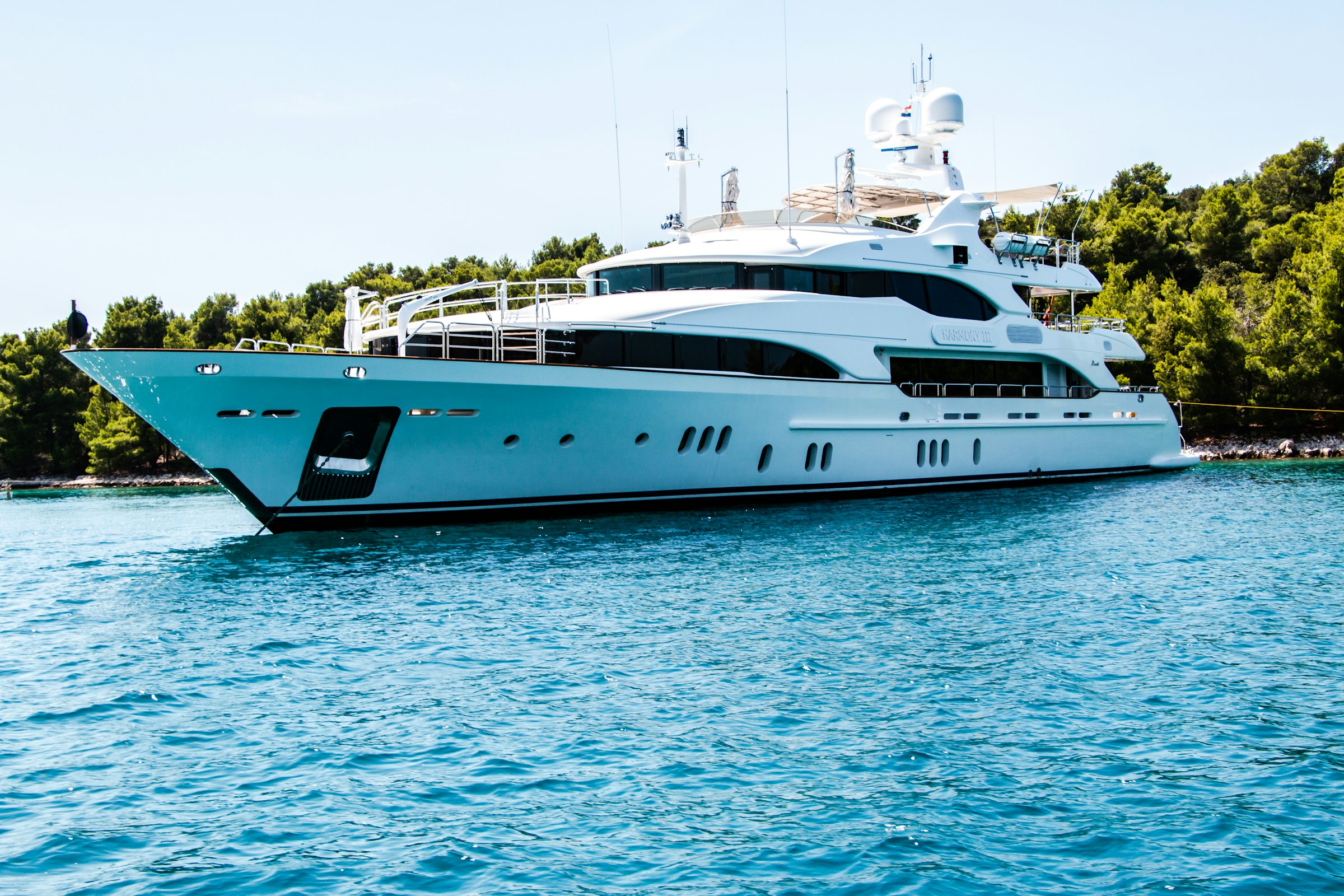 Superyacht anchored off the Marbella coastline at golden hour